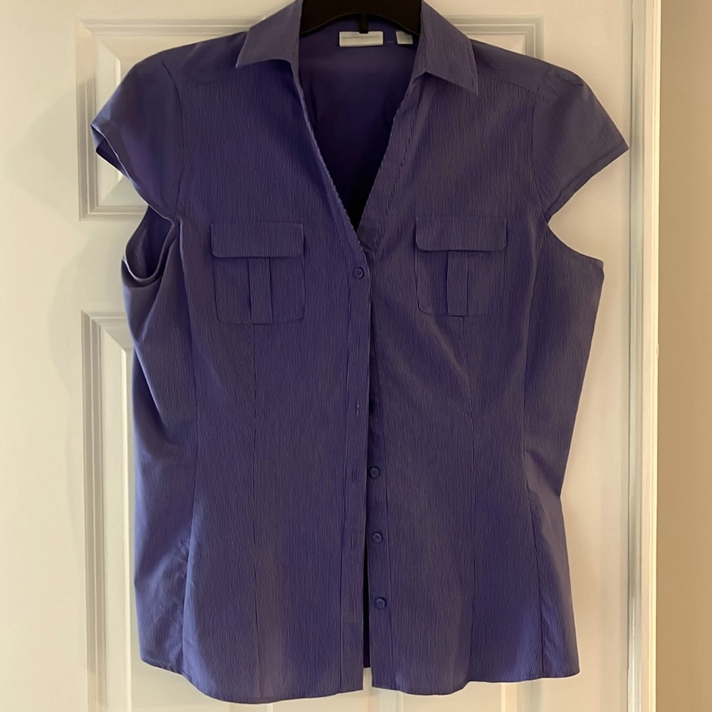 Flattering two pocket blue blouse